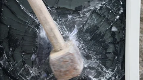 Breaking the TV with a sledgehammer Stock Footage 167335629