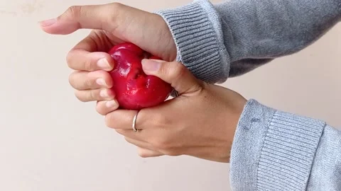 Breaking the water apple into two pieces Stock Footage 146260915