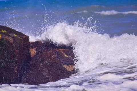 Breaking waters at the seashore Stock Photos