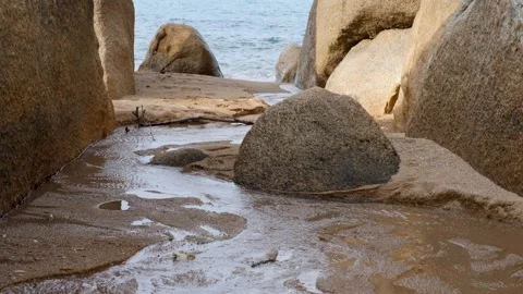Breaking wave between the stones Stock Footage 204824226