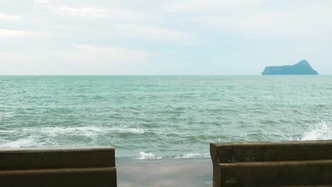 Breaking wave crash against the breakwater at Prachuap Bay Stock Footage 325408533