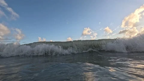 Breaking wave crashes over camera Stock Footage 229910886