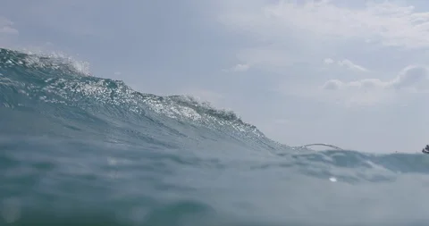Breaking wave under the water / slow-motion from underwater / 4K 120p Stockbeeldmateriaal 105863622