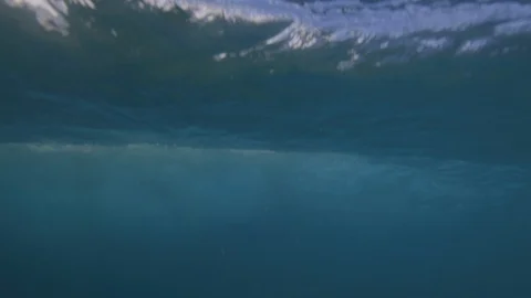 Breaking wave under the water / slow-motion from underwater / 4K 120p Stockbeeldmateriaal 121859776