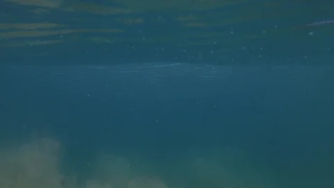 Breaking wave under the water / slow-motion from underwater / 4K 120p Stock Footage 121859818