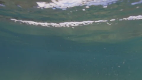 Breaking wave under the water / slow-motion from underwater / 4K 120p Stock Footage 121859962