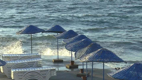 Breaking Waves And Parasols Bodrum Turkey Stock Footage 117724995