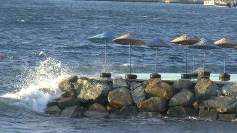 Breaking Waves And Parasols Bodrum Stock Footage 125770858
