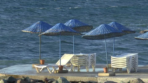 Breaking Waves And Parasols Stock Footage 121263841