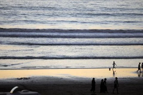 Breaking waves and people Stock Photos