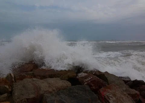 The breaking of the waves on the beach Stock Photos