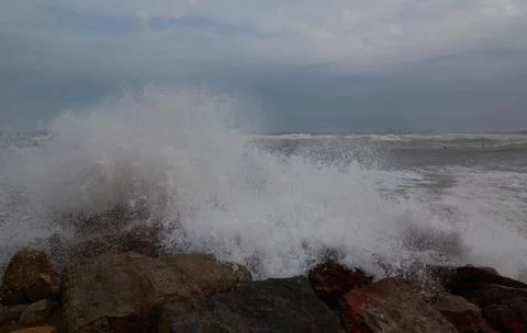 The breaking of the waves on the beach Stock Photos
