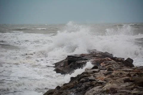 The breaking of the waves on the beach Stock Photos