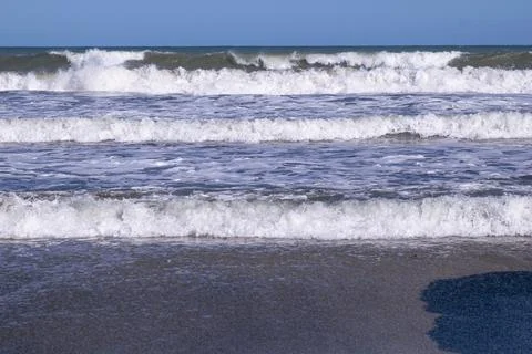 Breaking waves on the beach Stock Photos