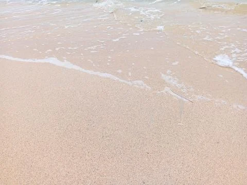 Breaking waves on the beach Stock Photos