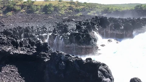 Breaking Waves on Lava Cliff Stock Footage 123626289
