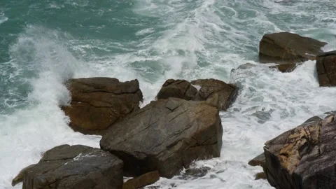 Breaking waves on rocks Stock Footage 161684954