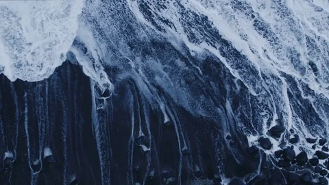 Breaking Waves on Rocky Coastline. Aerial Shot Stock Footage