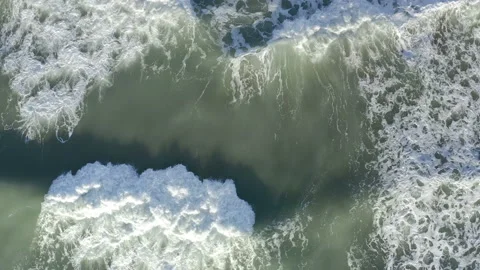 Breaking waves spume in agitated sea surface Stock Footage