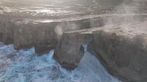 Breaking Waves On The Wied il-Mielaħ Window - Limestone Natural Arch On The Stock Footage 333465933