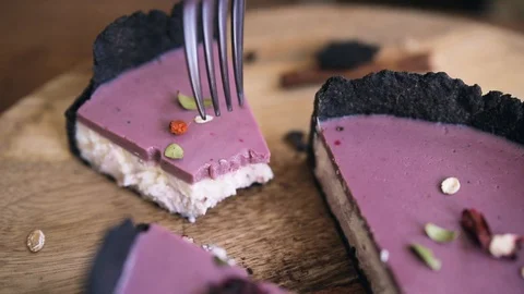 Breaks off a piece of cake with a fork. Close up Stock Footage 129234482