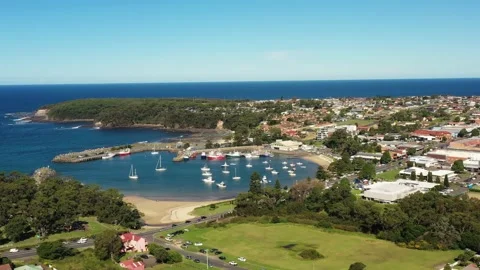 Breakwall protected harbour in Ulladulla coastal town of Australia in aerial 4k. Stock Footage 183606903