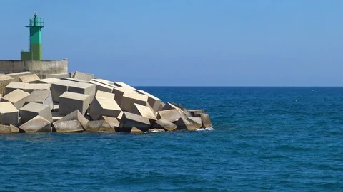 Breakwater and green lighthouse. Stock Footage 109593668