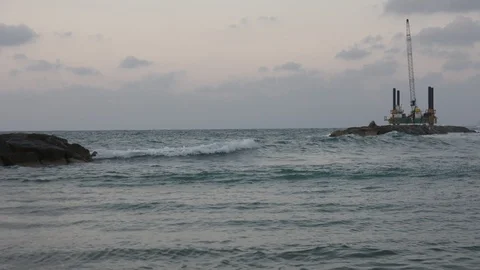 Breakwater and oil rig. variable focus Видео 92575574