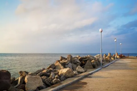 Breakwater with lampposts Stock Photos