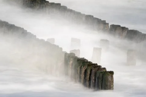 Breakwater in the surf Foto stock