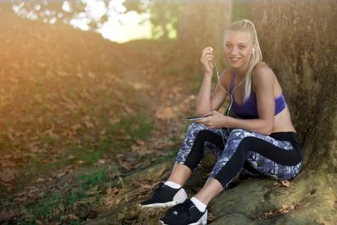 Breathing deep during jogging in the forest Foto stock