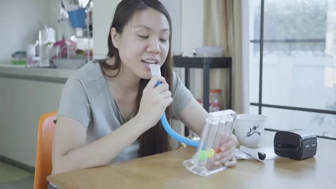Breathing Exercise with Flow Meter at Home Stock Footage 314456055