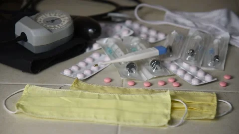 The breathing mask is on the table with pills and disposable syringes. Stock Footage 143594719