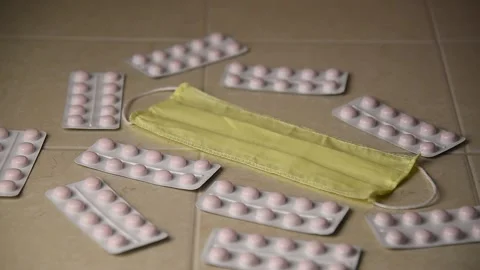 The breathing mask is on the table with the pills. Stock Footage 143593996