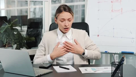 Breathing problems, chest pain, panic attack at work, asthma, heart attack. Stock Footage 233329414