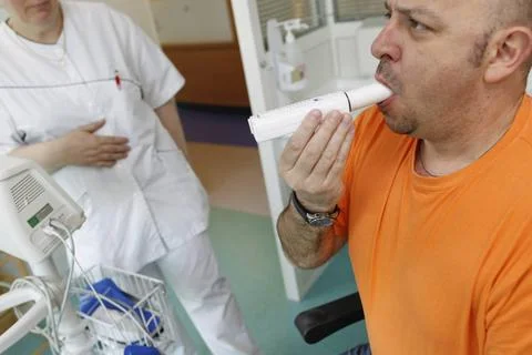  Breathing spirometry man Spirometry consists of measuring, using a spirom... Stock Photos