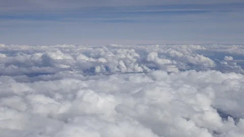 Breathtaking 4K aerial view of soft white clouds from an airplane window Stock Footage 317049127