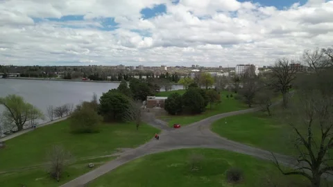 Breathtaking 4K Drone Pan of Forest, River &amp; Cityscape Views Stock Footage 314215718