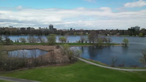 Breathtaking 4K Drone Pan of Forest, River &amp; Cityscape Views Stock Footage 314215743