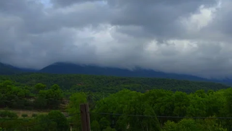 Breathtaking 8K Timelapse of Gray Clouds Over Forests and Mountains of Cucuron Stock Footage 251883582