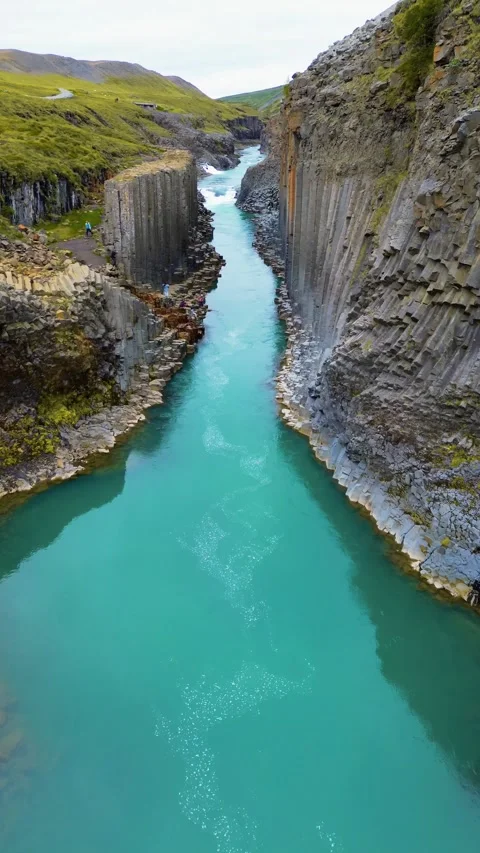 A breathtaking aerial drone flight through the stunning Studlagil Canyon in East Stock Footage 285536969