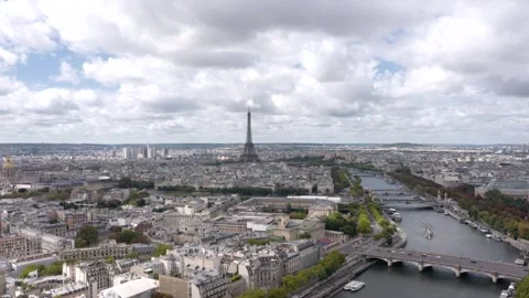 A breathtaking aerial drone shot captures the Eiffel Tower rising above Paris Stock Footage 317983473