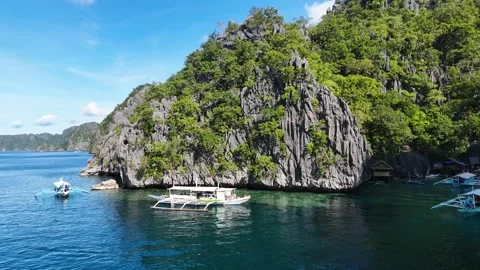 Breathtaking aerial drone view of the iconic twin lagoon in Coron, showcasing Video stock 295909581