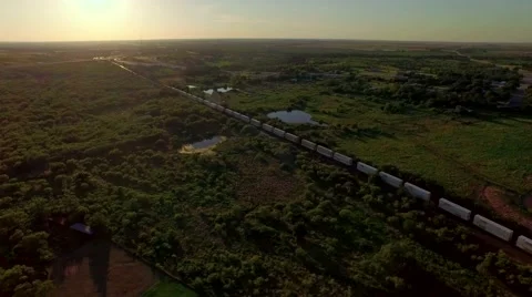 Breathtaking aerial of a freight train passing through countryside Stock Footage 53118278