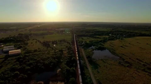 Breathtaking aerial of a freight train passing through countryside Stock Footage 53118789