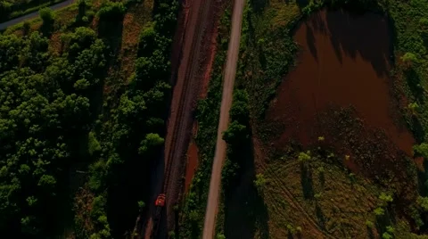 Breathtaking aerial of a freight train passing through countryside Stock Footage 53119050