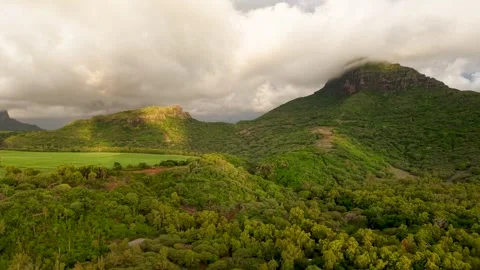 Breathtaking aerial panorama of a mountain range with peaks shrouded in clouds Stock Footage 313528253