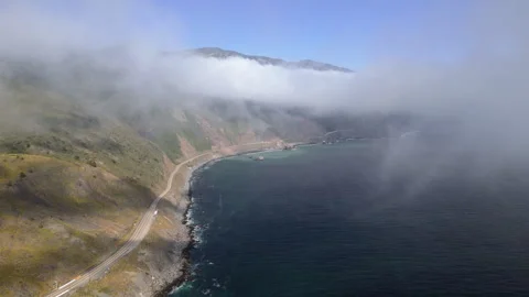 Breathtaking aerial shot over the clouds by California cost highway 1 near Big Video stock 276528688