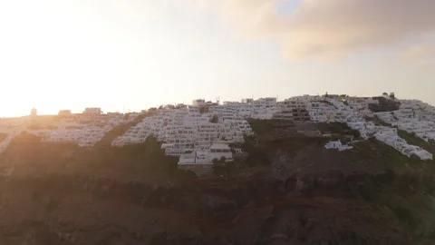 Breathtaking Aerial View of Beautiful Whitewashed Homes Poised on a Clifftop Video stock 317146507