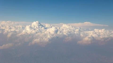 A breathtaking aerial view captures the soft, billowing clouds floating grace Stock Photos